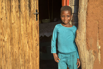Portrait of boy standing outdoors