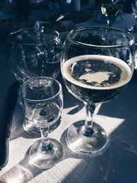 Close-up of wine glasses on table