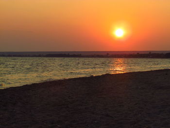 Scenic view of sea at sunset