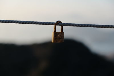 Close-up of padlocks on fence