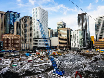Modern buildings against sky in city
