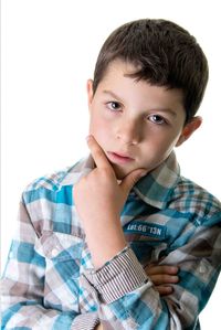 Portrait of boy against white background