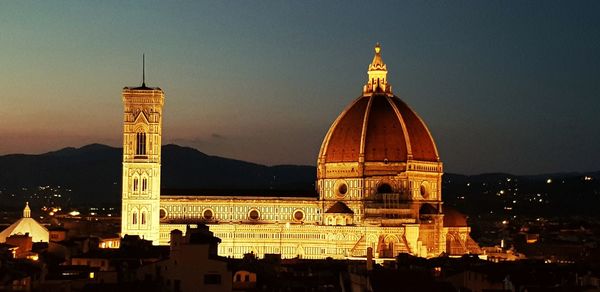 Illuminated cathedral against sky at night