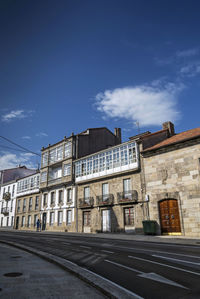 Low angle view of buildings against blue sky