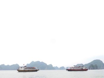 Boats sailing in sea