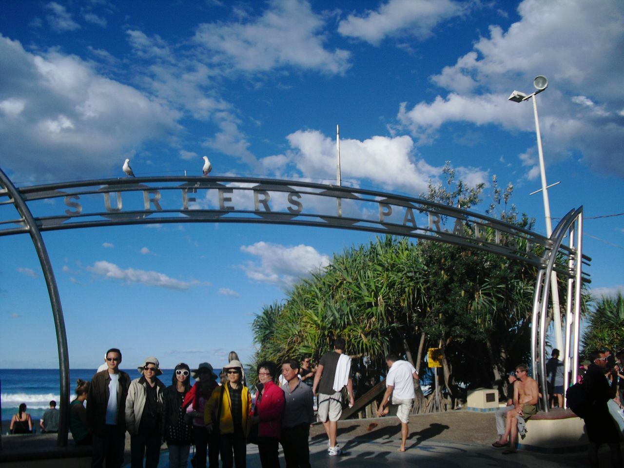 REAR VIEW OF PEOPLE ON ROAD