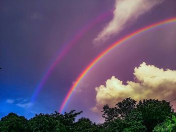 Low angle view of rainbow against sky