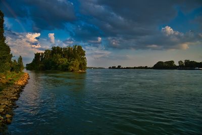 Scenic view of lake against sky during sunset