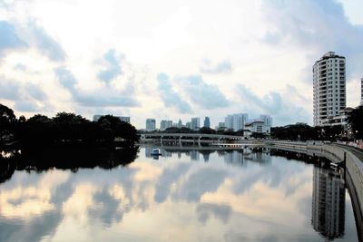 Modern buildings against cloudy sky