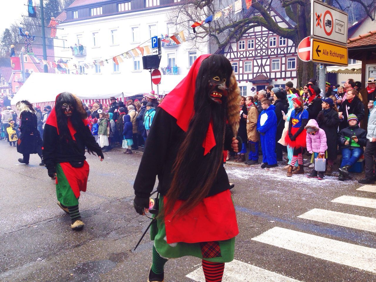 PEOPLE WALKING ON STREET IN CITY