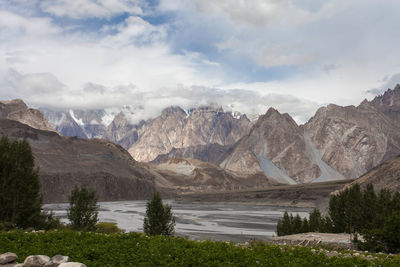 Scenic view of lake and mountains against sky