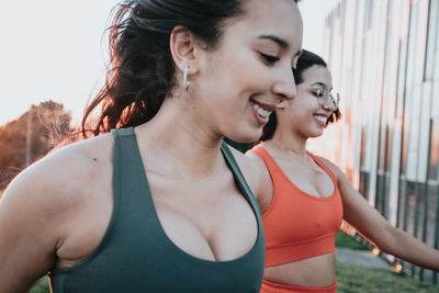 Smiling female friends exercising