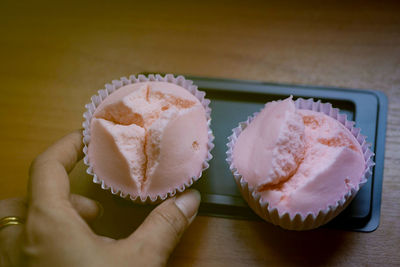 Close-up of hand holding ice cream