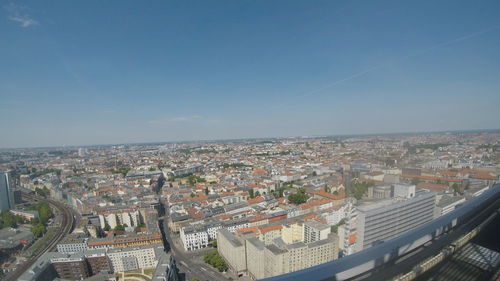 High angle view of city buildings against clear sky