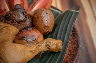 High angle view of meat on barbecue grill