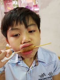 Portrait of boy eating