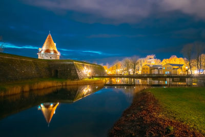 Reflection of illuminated buildings in water