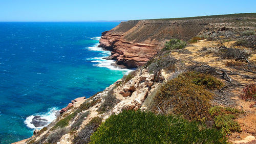 Scenic view of sea against clear blue sky