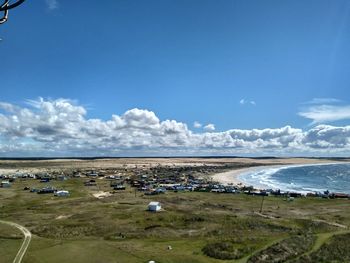 Scenic view of beach against blue sky