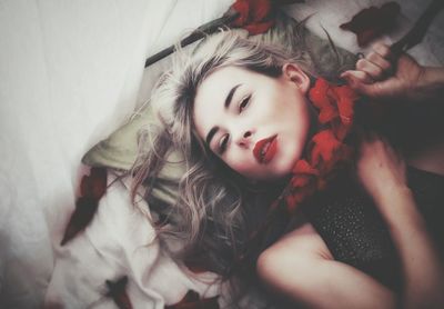 Portrait of girl lying on bed at home