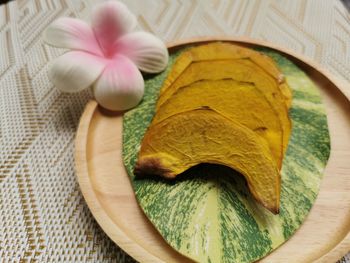 High angle view of pink flower on table