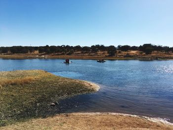 Scenic view of lake against clear sky