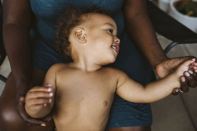 Toddler on parents laps