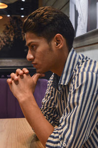 Portrait of young man looking away