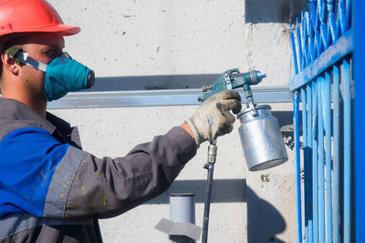 Side view of man working in factory