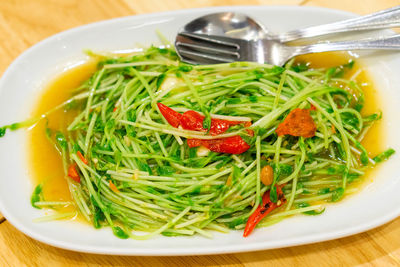 Close-up of chopped vegetables in plate on table