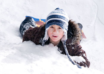 Portrait of smiling young woman in snow