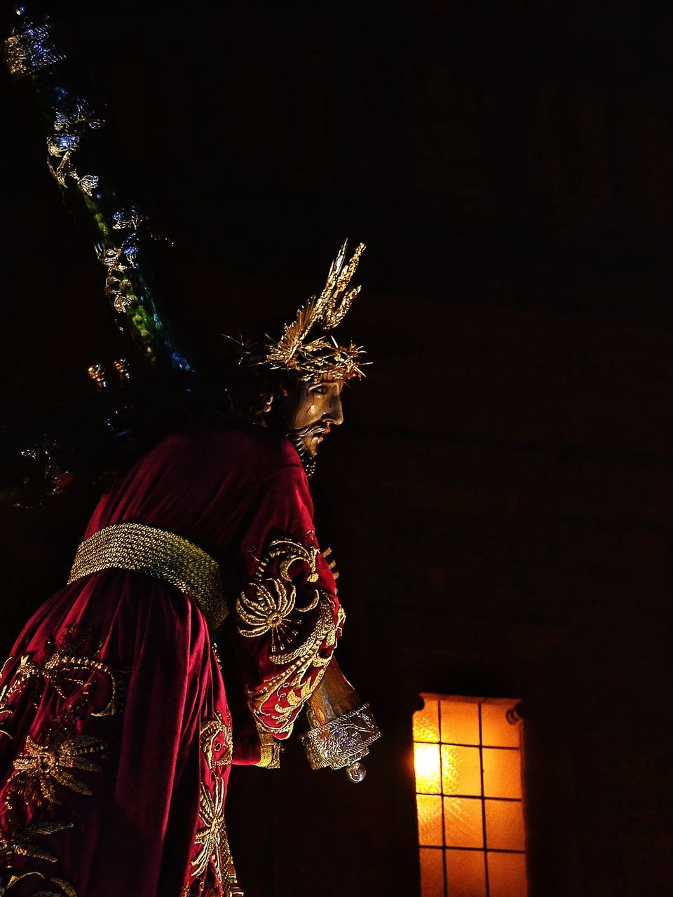 night, illuminated, low angle view, religion, celebration, tradition, lighting equipment, decoration, spirituality, built structure, place of worship, cultures, christmas, building exterior, architecture, temple - building, art and craft, art, statue