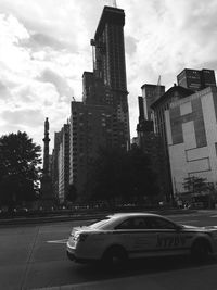 City street against cloudy sky