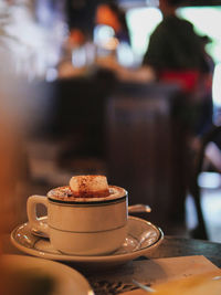 Close-up of coffee cup on table