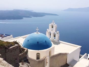 High angle view of church against calm blue sea