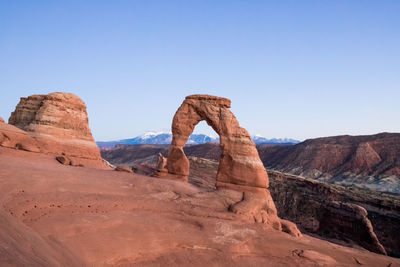 Rock formation in desert against clear sky