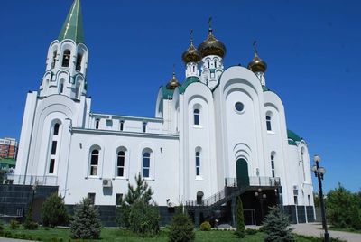 Low angle view of buildings against blue sky