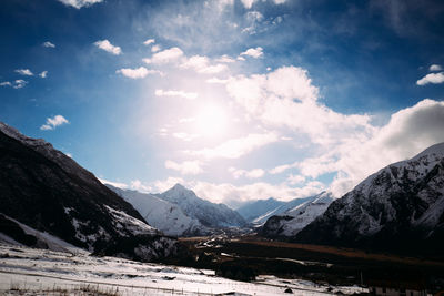 Scenic view of snowcapped mountains against sky