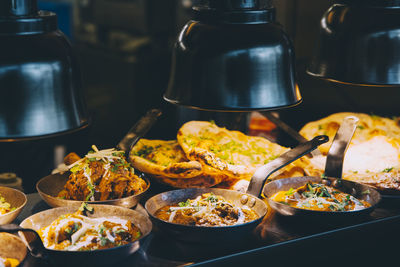 High angle view of indian food served on concession stand of commercial land vehicle