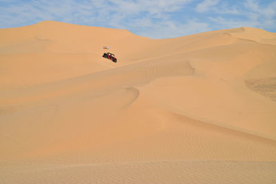 High angle view of tire tracks in desert