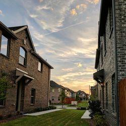 Houses in city against sky