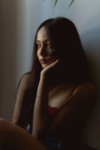 Portrait of a young woman looking away