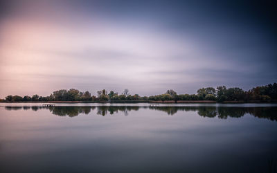 Scenic view of lake against sky during sunset