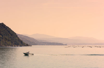 Scenic view of sea against clear sky during sunset