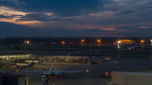 High angle view of illuminated airport runway at night