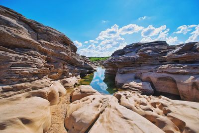 Low angle view of rocks against sky