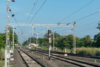 Railroad tracks against clear sky