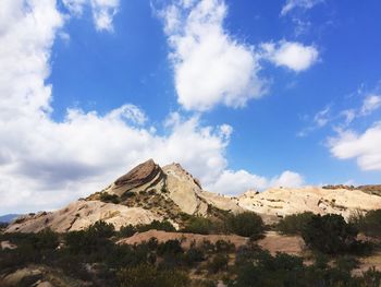 Scenic view of mountains against cloudy sky