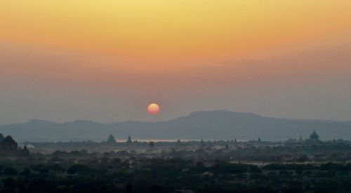 Scenic view of landscape against sky during sunset