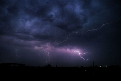 Scenic view of lightning in sky at night